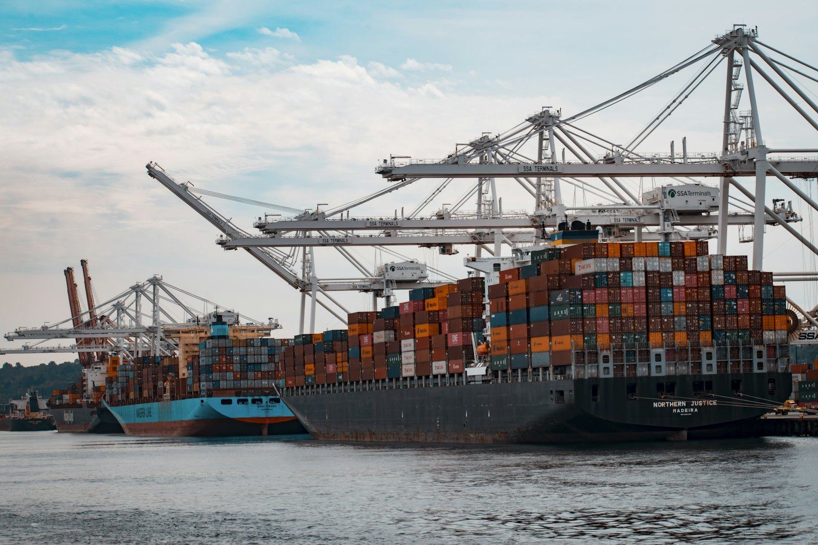 A container ship being worked at an export port