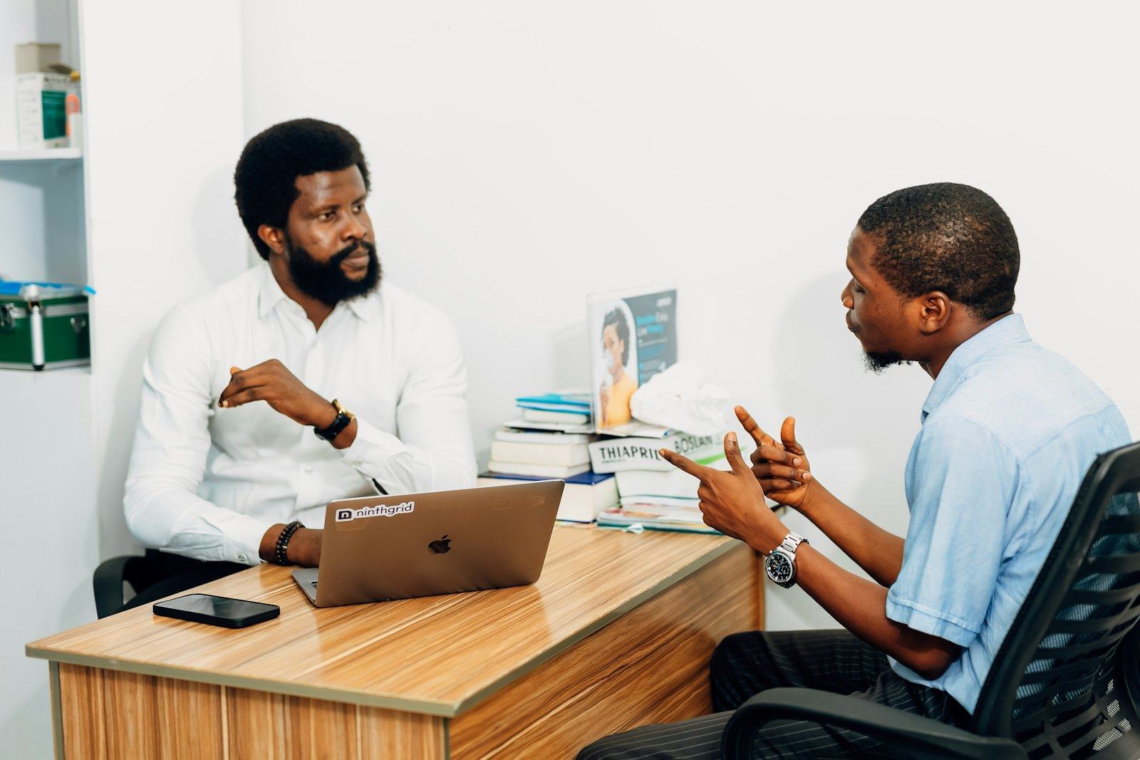 Two people in conversation across a table