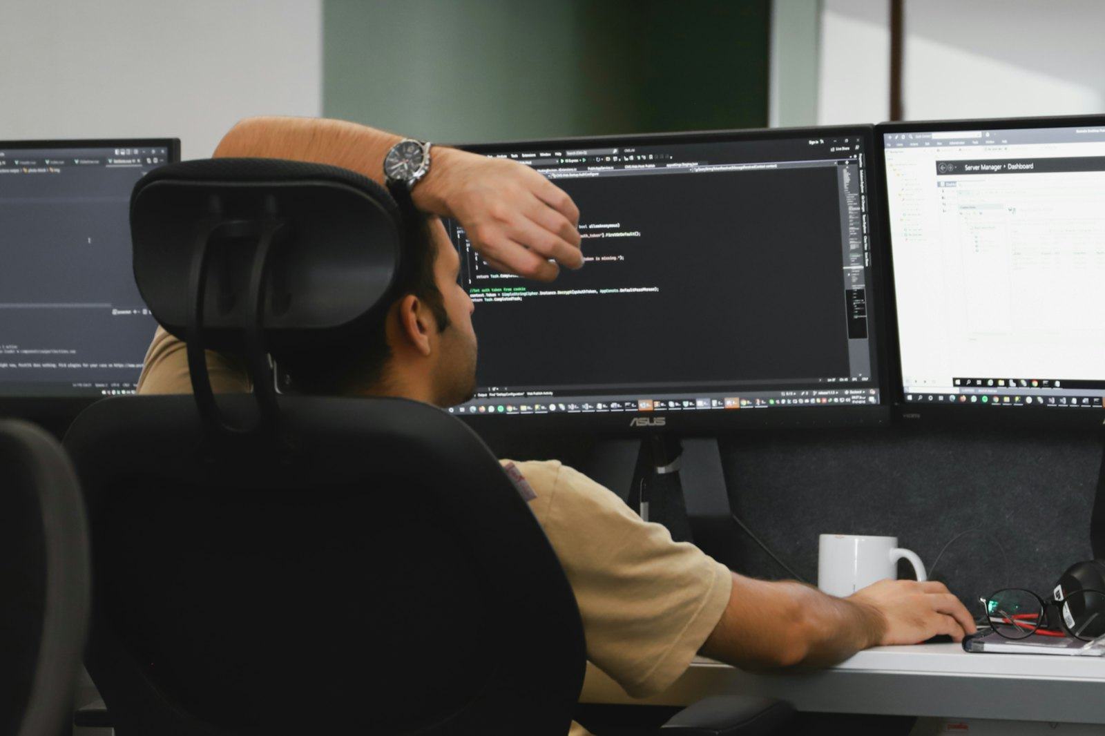 An engineer reviewing sensor output on screens