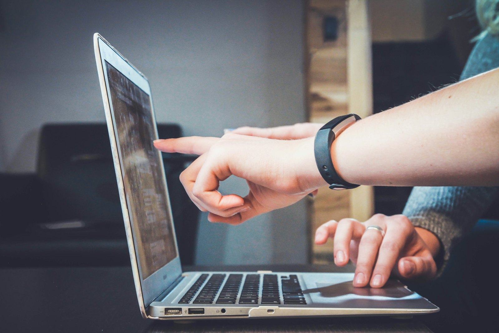 Figures being reviewed on a laptop