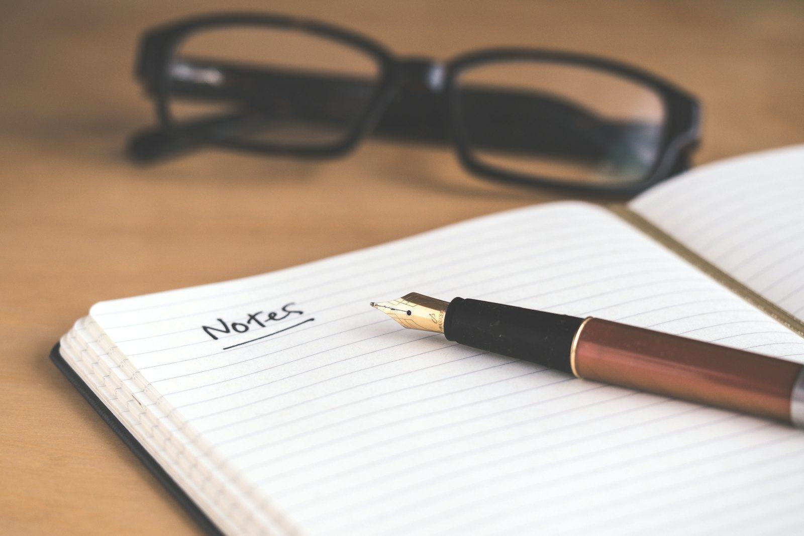 A written view being drafted in a notebook
