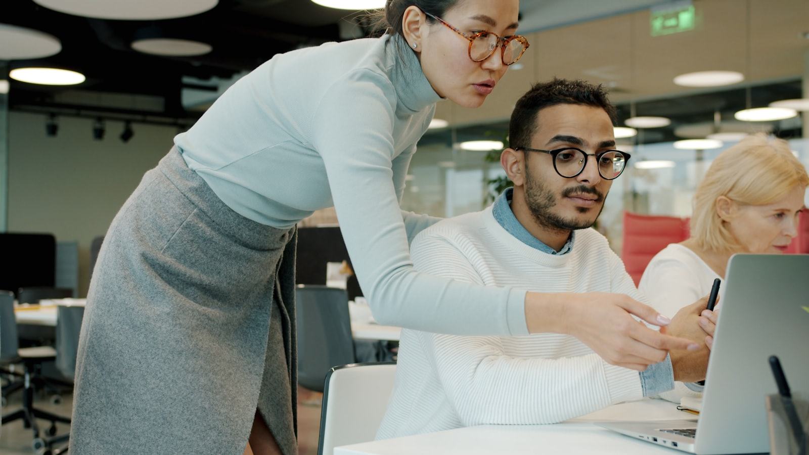 A team reviewing product research on a laptop
